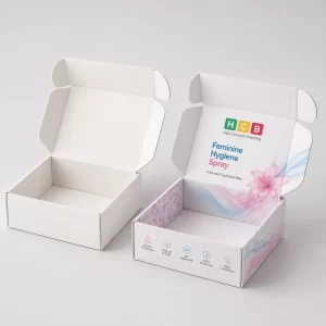Two tall rectangular boxes, one blank white and one featuring elegant blue floral product designs.