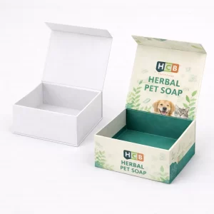 Two sliding drawer-style sleeve boxes, one plain white and one featuring teal wave patterns and branding.