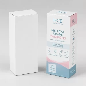 Two rectangular boxes, one blank white and one with elegant teal floral patterns and logos.