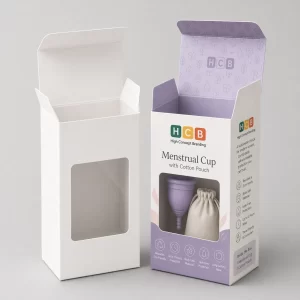 Two boxes with circular window cutouts, one plain and one printed with pink floral patterns