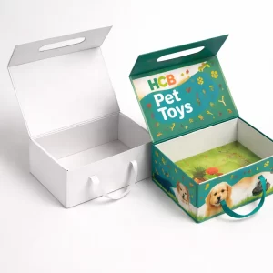 Two vertical retail boxes, one minimalist white and one with a transparent window showing colourful pet toys.