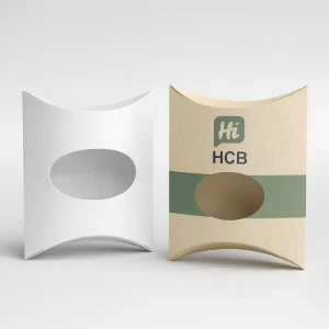 White pillow box and decorative tan-teal pillow box- both featuring an oval window cutout