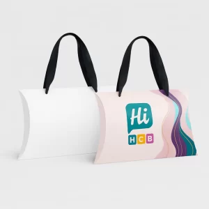 Two pillow boxes with black ribbon handles- one plain white and one with colourful swirls