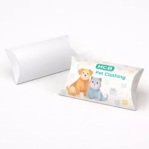 Two pillow-shaped packaging boxes, one plain white and one printed with teal waves and HCB logo.