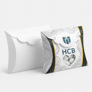 White pillow boxes- one with a wavy pattern- heart-shaped window- and candy inside
