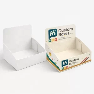Two cardboard counter display boxes, one plain white and one branded for retail taco shells.