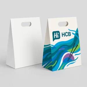 Tall paper carrier boxes with cut-out handles- featuring white and blue wave-patterned printed designs