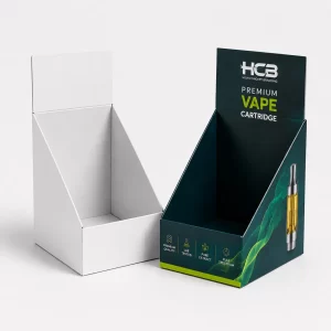 Custom printed cardboard counter display boxes for wholesale vape cartridges beside a blank white sample.