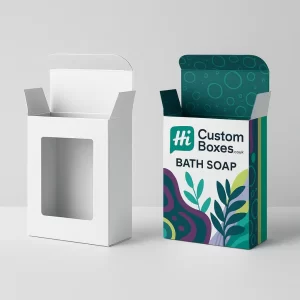 Tall rectangular bath soap boxes with windows- one white- one printed with abstract floral shapes
