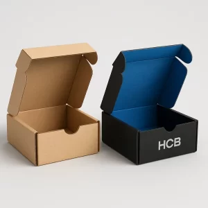 Open custom cardboard battery packaging boxes- featuring a plain brown kraft style and a black box with a vibrant blue interior and -HCB- logo