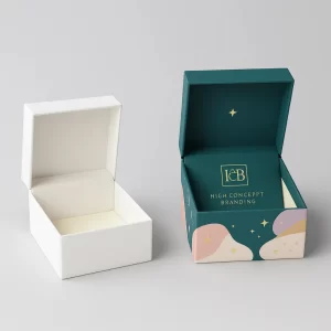 Two white and branded bespoke earring boxes- open- showing custom printing and fabric lining
