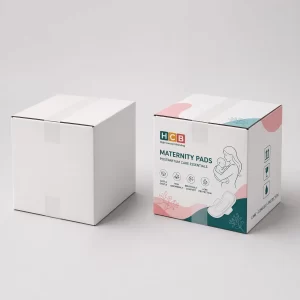 An open and closed pink floral branded box designed for eco-friendly maternity pad packaging. class= Image Title: N