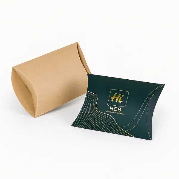 Pillow boxes - one plain kraft- one dark green with gold wave accents and Hi Custom Boxes logo