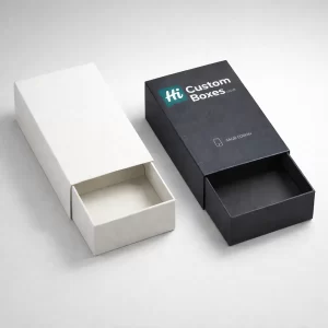 Two sliding drawer-style matchbox packs, showing a minimalist white sleeve and a black branded sleeve partially open.