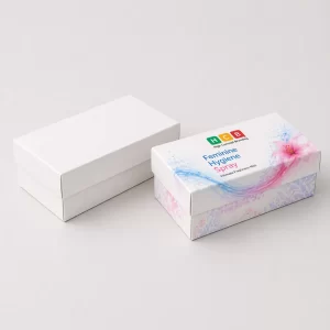 Two vertical cardboard boxes, one plain white and one with blue floral hygiene spray branding.