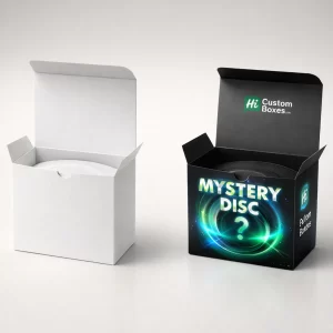 Two open square boxes containing a disc, one plain white and one black