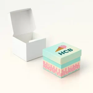 Small ice cream cardboard box with a separate lift-off lid- featuring a colorful base with a dripping pattern and a branded lid- shown next to a plain white open box