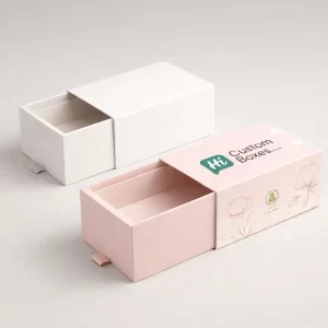 Two sliding drawer-style boxes, featuring a minimalist white design and a pink floral branded version.