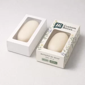 Two-piece white soap boxes featuring a transparent window and botanical floral illustrations on the side.