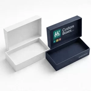 Two rectangular two-piece gift boxes shown open, including a plain white design and a navy blue branded version.
