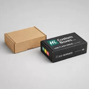 Two small cardboard mailer boxes, one plain brown and one printed black with a company logo.