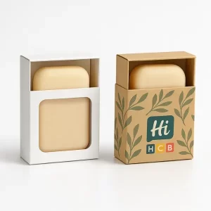 Two rectangular soap boxes with front windows - one plain white- one kraft with leafy Hi HCB branding